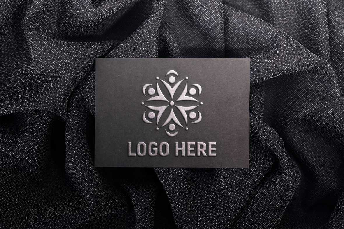 Embossed logo mockup on black paper