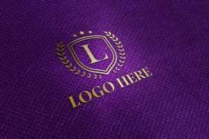 Gold Logo Mockup on Purple Fabric Texture