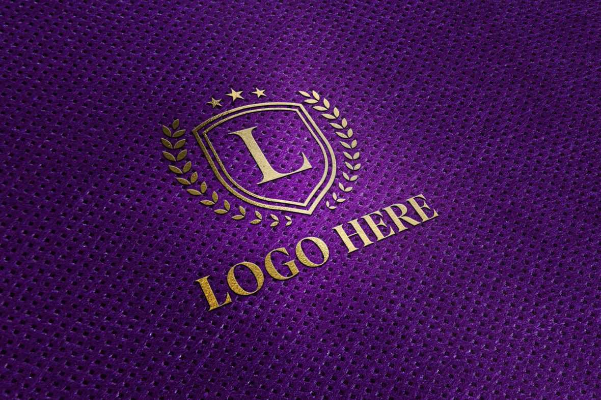 Gold Logo Mockup on Purple Fabric Texture