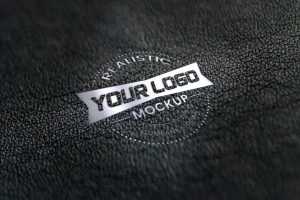 Realistic silver logo mockup on black leather