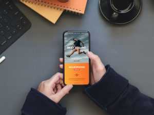 A Person Holding an iPhone Free Mockup PSD
