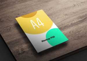 Free A4 Flyer Mockup PSD on a Wooden Table