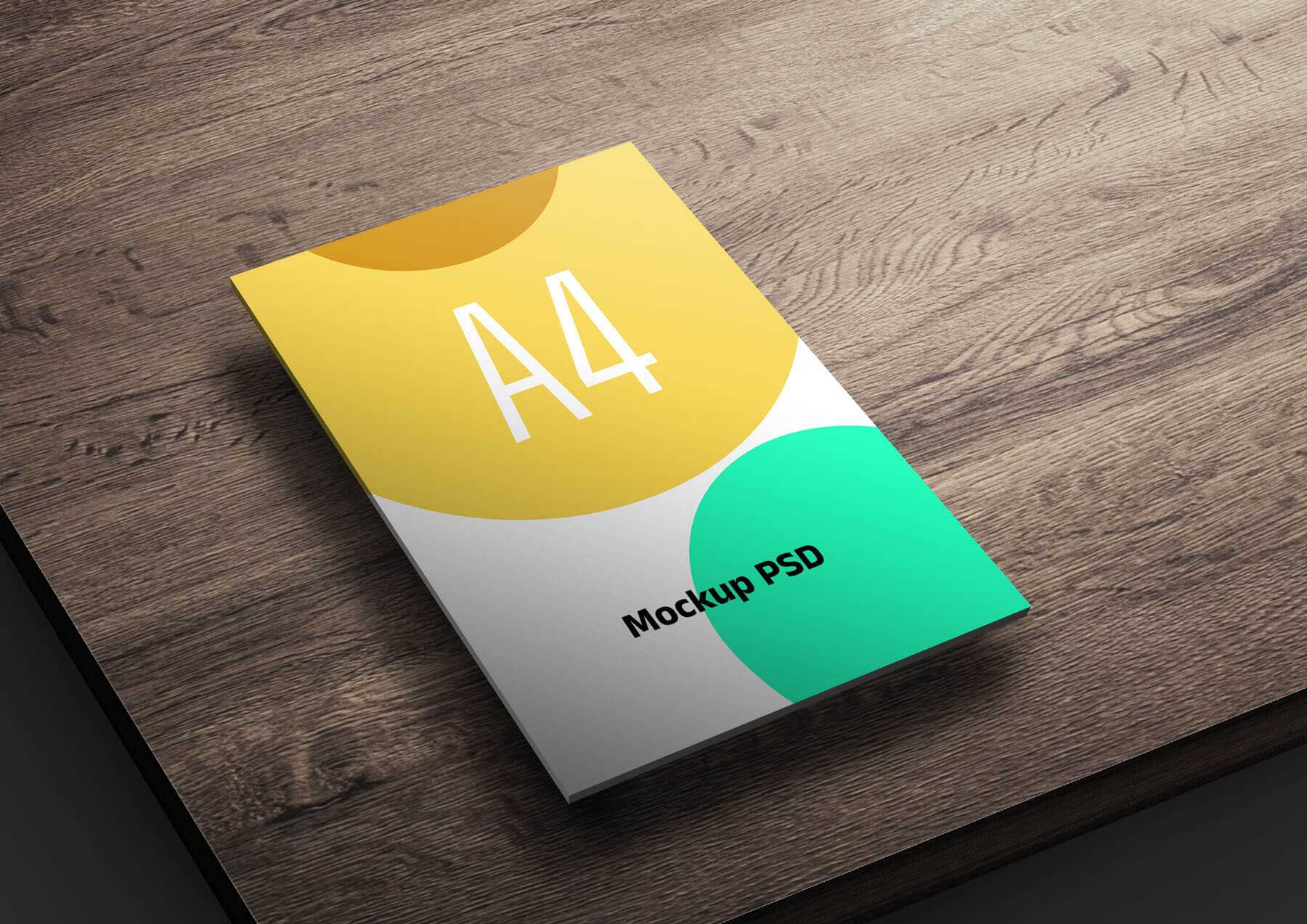 Free A4 Flyer Mockup PSD on a Wooden Table