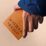 Free A5 Notebook in Hand Mockup