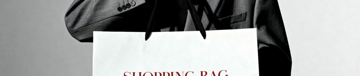 Free B&W Model Holding Shopping Bag Mockup