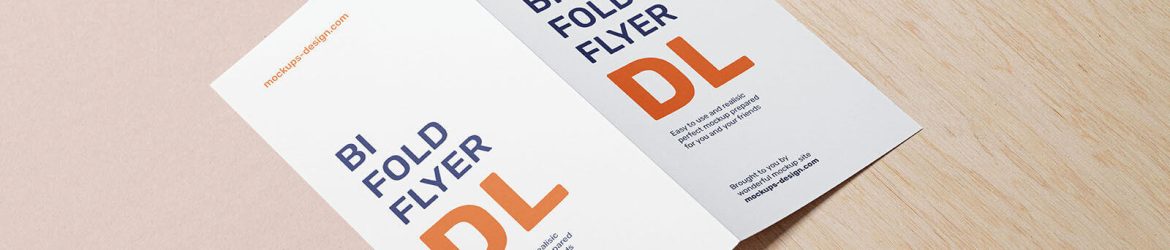 Free Bifold Dl Flyer Mockup Lying on a Wooden Board PSD