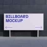 Free Billboard in front of Dark Building Mockup