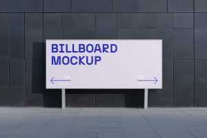 Free Billboard in front of Dark Building Mockup