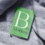 Free Book Cover Mockup on Blanket Background