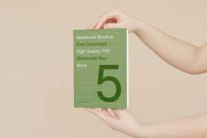 Free Book in Man Hands Mockup