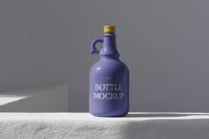 Free Bottle Standing on Concrete Mockup