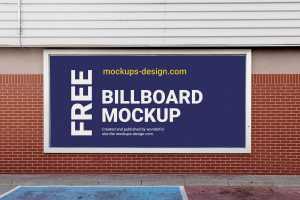 Free Brick Wall Mounted Billboard Mockup PSD
