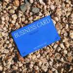 Free Business Card Laying on Stones Mockup