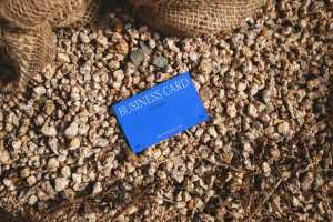 Free Business Card Laying on Stones Mockup