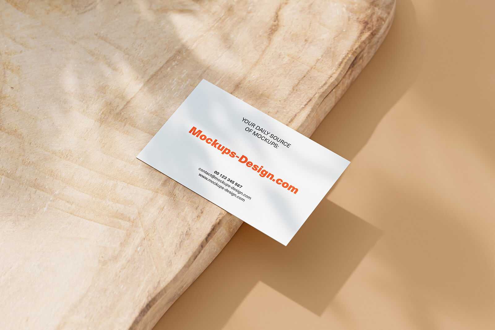 Free Business Card Mockups set on Piece Wood