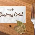 Free Business Card on Wooden Kitchen Table Mockup PSD