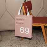 Free Canvas Bag Hanging on Chair Mockup