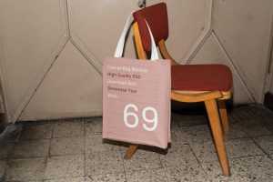 Free Canvas Bag Hanging on Chair Mockup