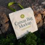 Free Canvas Bag Laying on Stones Mockup