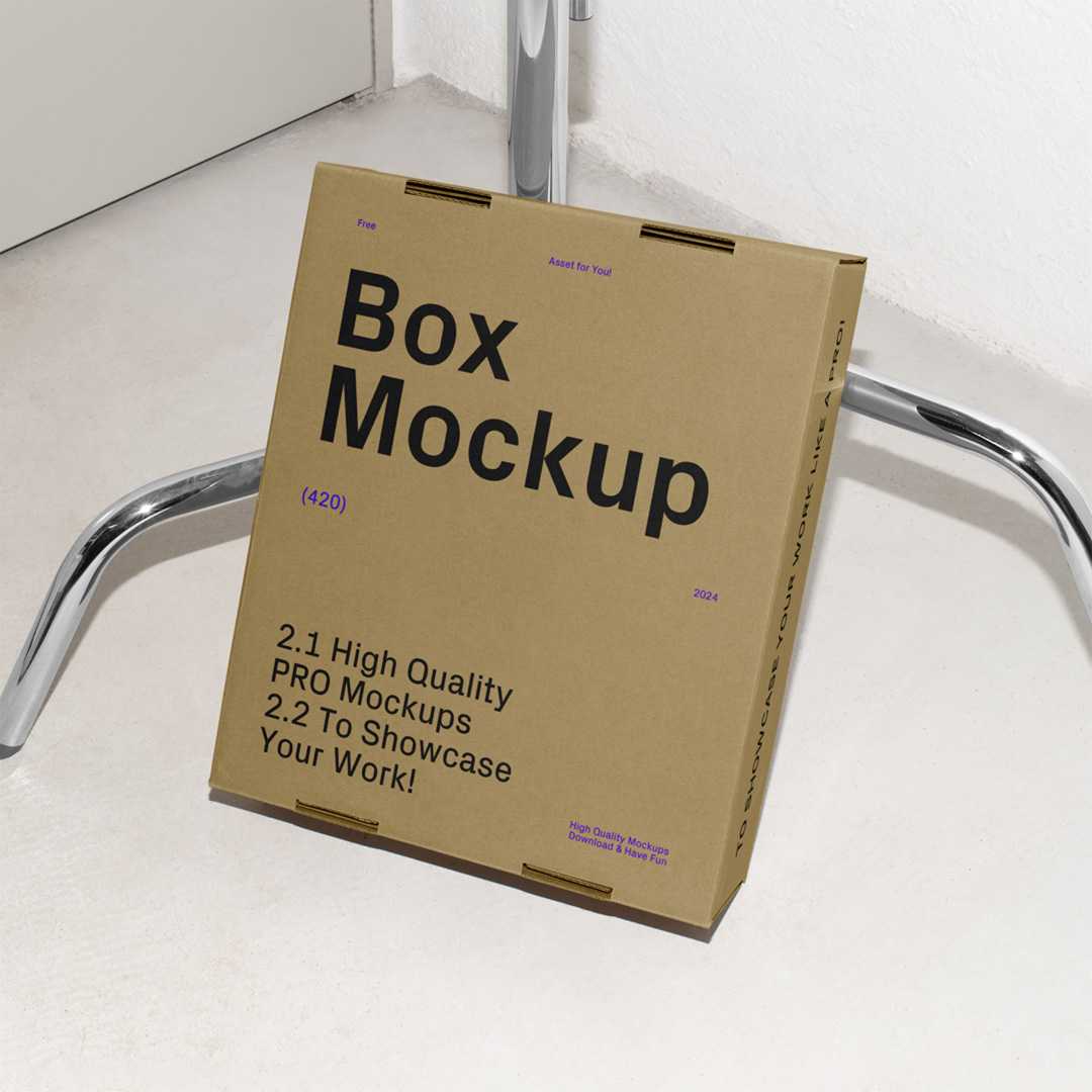 Free Cardboard Box Leaning Against the Tripod Mockup