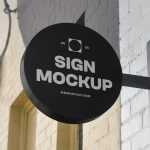 Free Circle Signage Attached to Wall Mockup
