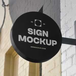 Free Circle Signage Attached to Wall Mockup