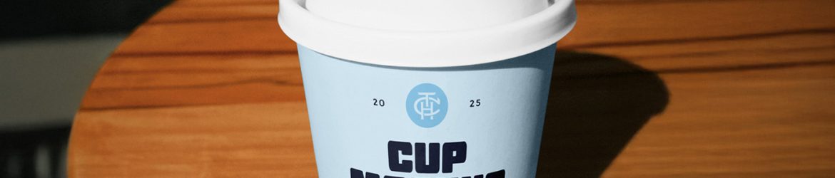 Free Coffe Cup on a Table PSD Mockup