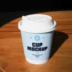 Free Coffe Cup on a Table PSD Mockup
