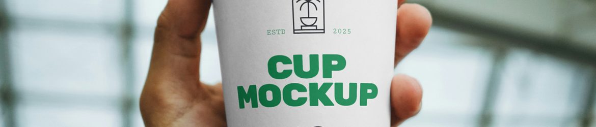 Free Coffee Cup in Hand Mockup