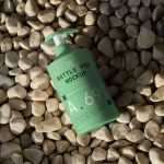 Free Cosmetic Bottle on the Beach Mockup