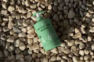 Free Cosmetic Bottle on the Beach Mockup