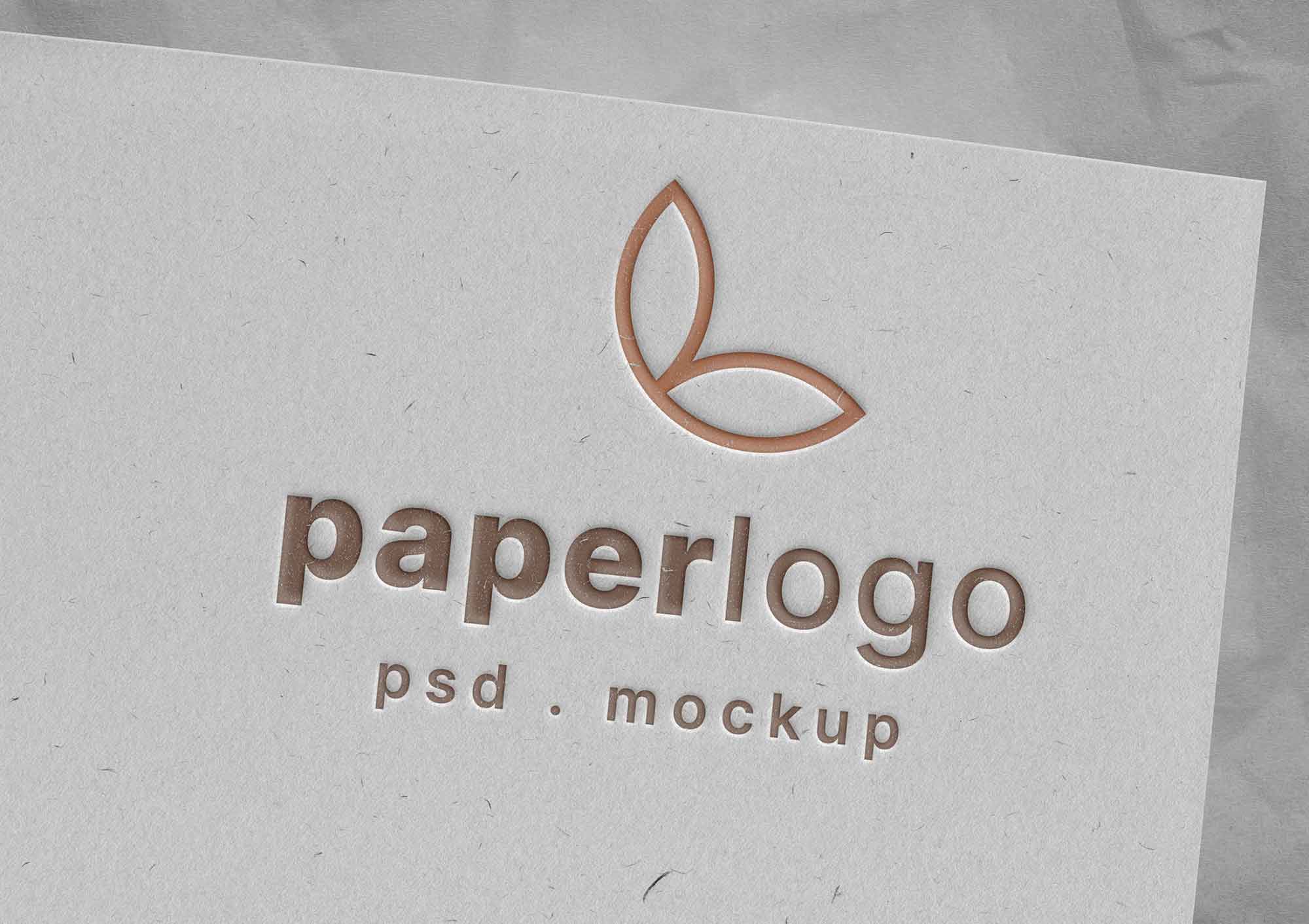 Free Debossed Logo Mockup PSD on Textured Paper