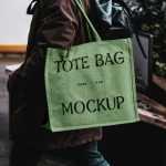 Free Eco Bag Carrying by Man Mockup