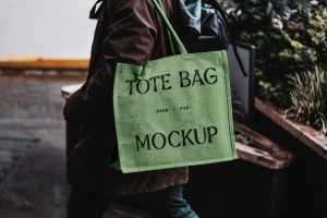 Free Eco Bag Carrying by Man Mockup