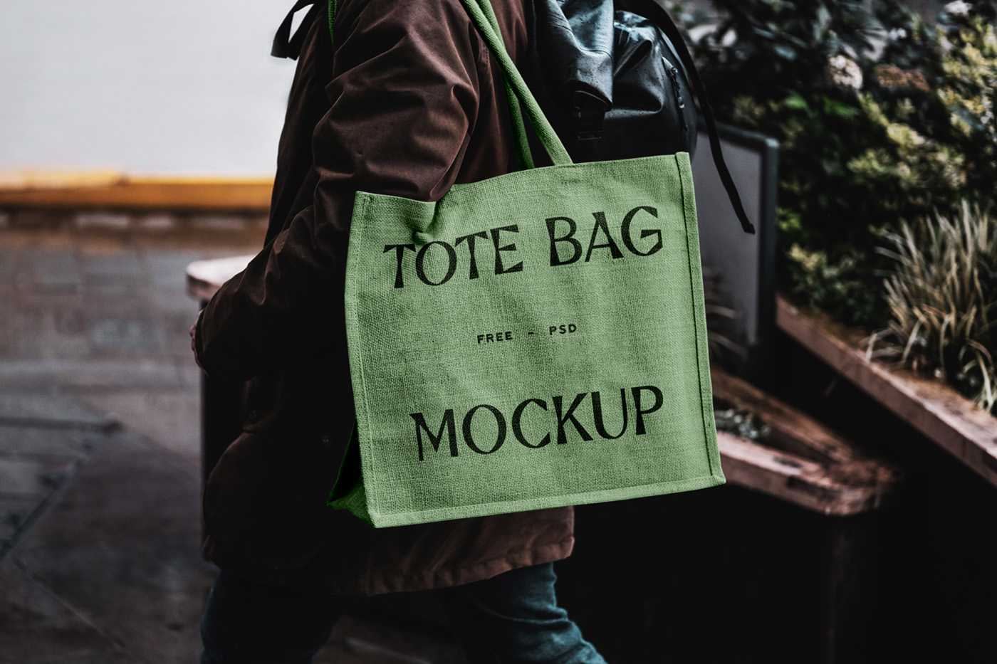 Free Eco Bag Carrying by Man Mockup