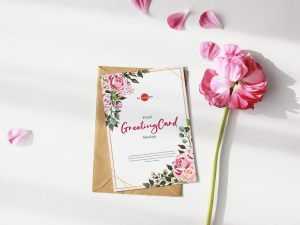 Free Greeting Card Mockup with Pink Flowers PSD
