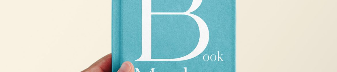 Free Hand Holding Book Cover Mockup PSD