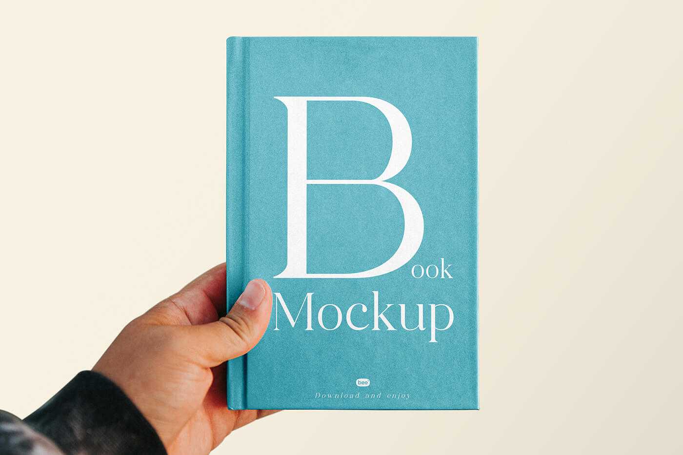 Free Hand Holding Book Cover Mockup PSD