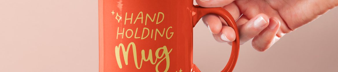 Free Hand Holding Mug PSD Mockup