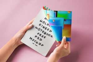Free Hand Holding Ring Binding Notebook Mockup PSD