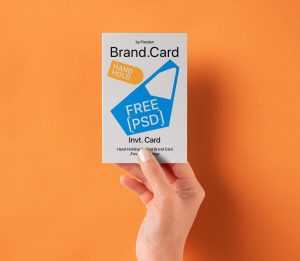 Free Hand Holding Vertical Greeting / Invite Card Mockup PSD PSD