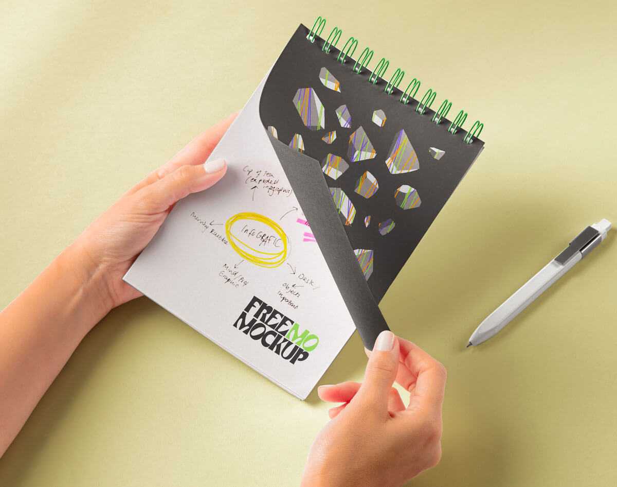 Free Hands Holding Spiral Spiral Notepad Mockup PSD