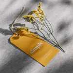 Free Hanging Tag PSD Mockup with Yellow Flower - Free PSD Download Free Hanging Tag PSD Mockup with Yellow Flower