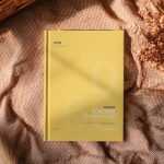 Free Hardcover Book Mockup – Top View on Cozy Fabric Scene