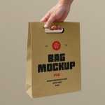 Free Holding Craft Paper Bag Mockup