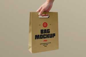 Free Holding Craft Paper Bag Mockup