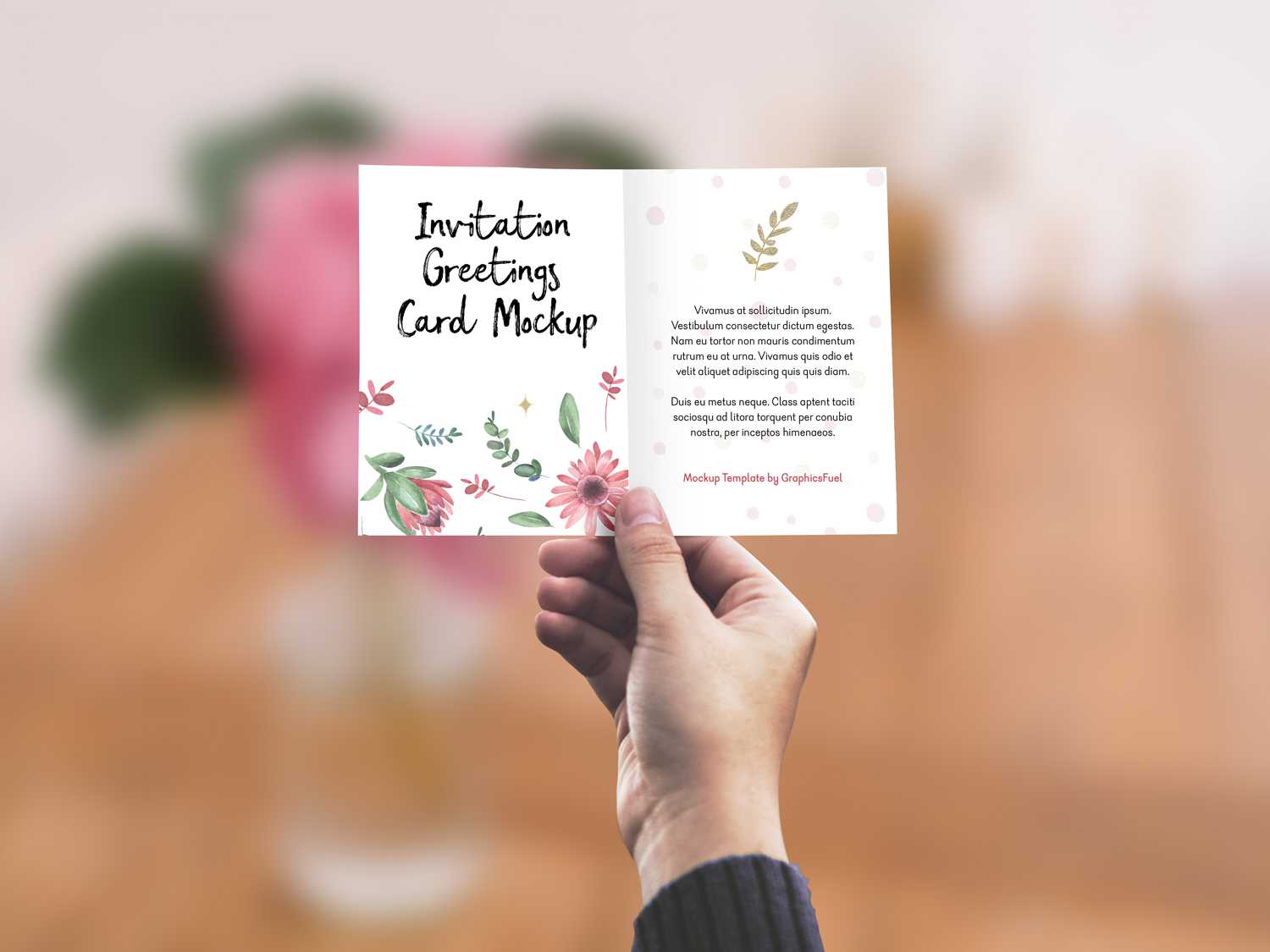 Free Invitation/Greeting Card in Hand Mockup PSD