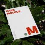 Free Laying Card Between Flowers Mockup - Free PSD Download Free Laying Card Between Flowers Mockup