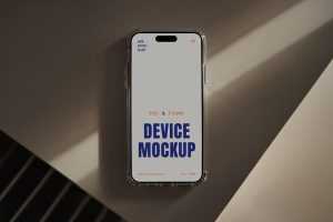 Free Laying iPhone 16 Pro on Table Mockup