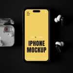 Free Laying iPhone with Accessories Mockup